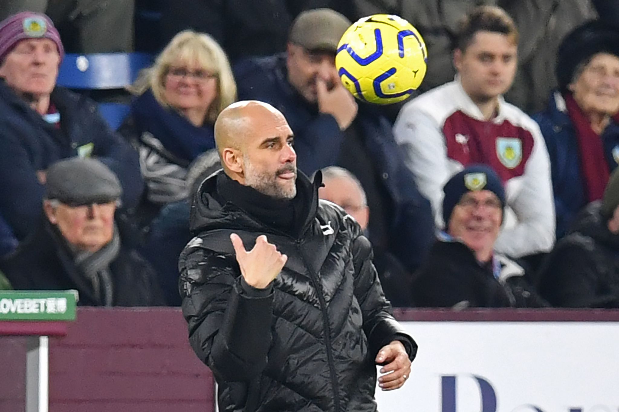Manchester Citys Spanish manager Pep <HIT>Guardiola</HIT> returns the ball during the English Premier League football match between Burnley and Manchester City at Turf Moor in Burnley, north west England on December 3, 2019. (Photo by Paul ELLIS / AFP) / RESTRICTED TO EDITORIAL USE. No use with unauthorized audio, video, data, fixture lists, club/league logos or live services. Online in-match use limited to 120 images. An additional 40 images may be used in extra time. No video emulation. Social media in-match use limited to 120 images. An additional 40 images may be used in extra time. No use in betting publications, games or single club/league/player publications. /