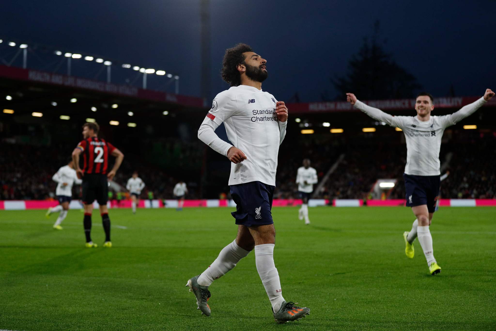 Liverpools Egyptian midfielder Mohamed <HIT>Salah</HIT> celebrates scoring their third goal during the English Premier League football match between Bournemouth and Liverpool at the Vitality Stadium in Bournemouth, southern England on December 7, 2019. (Photo by Adrian DENNIS / AFP) / RESTRICTED TO EDITORIAL USE. No use with unauthorized audio, video, data, fixture lists, club/league logos or live services. Online in-match use limited to 120 images. An additional 40 images may be used in extra time. No video emulation. Social media in-match use limited to 120 images. An additional 40 images may be used in extra time. No use in betting publications, games or single club/league/player publications. /