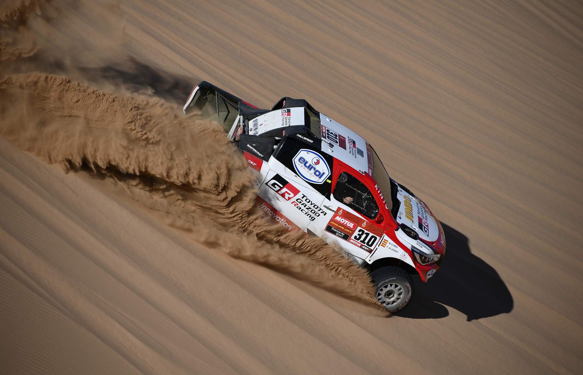 Toyotas Hilux Gazoo racing driver Frenando <HIT>Alonso</HIT> of Spain and co-driver Marc Coma of Spain compete during the Stage 1 of the Dakar 2020 between Jeddah and Al Wajh, Saudi Arabia, on January 5, 2020. (Photo by FRANCK FIFE / AFP)