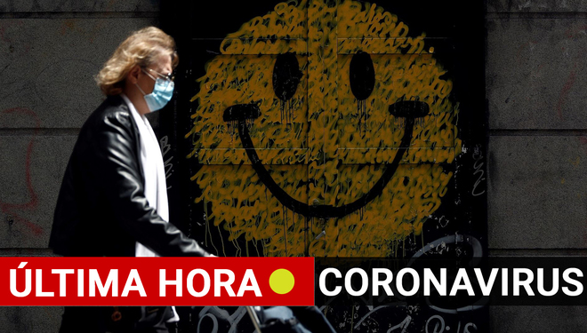 Coronavirus en Espaa, ltima hora: Una mujer camina con la imagen...