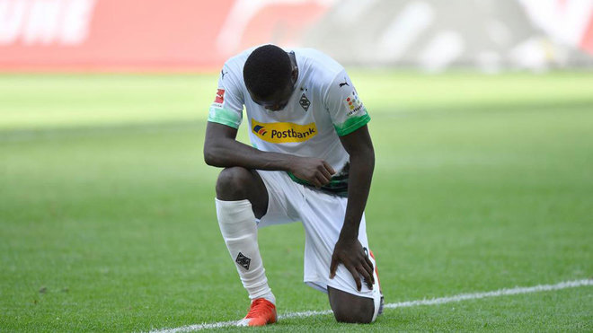 Marcus Thuram takes a knee after scoring to honour the memory of George Floyd