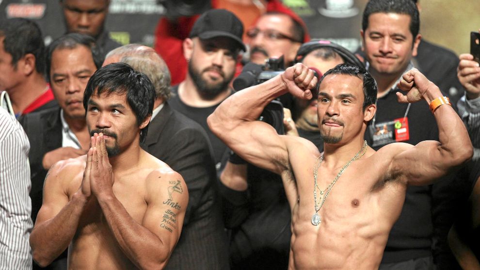 Manny Pacquiao (L) of the Philippines and lt;HIT gt;Juan lt;/HIT gt; lt;HIT gt;Manuel lt;/HIT gt; lt;HIT gt;Marquez lt;/HIT gt; (R) of Mexico pose during their weigh-in December 7, 2012 in Las Vegas, Nevada. Filipino southpaw Pacquiao needs a statement victory over lt;HIT gt;Marquez lt;/HIT gt; in the fourth installment of their epic rivalry December 8, 2012 to prove once and for all who is the better fighter. TOPSHOTS AFP PHOTO / John GURZINSKI