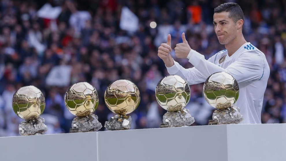 Cristiano with his five Ballon d&apos;Or trophies.