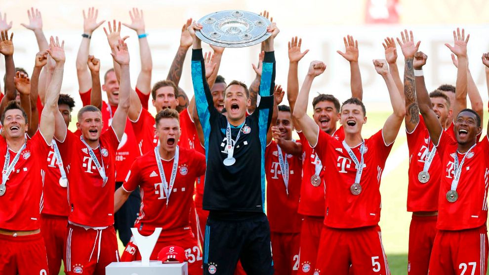 Neuer lifts the Bundesliga trophy.