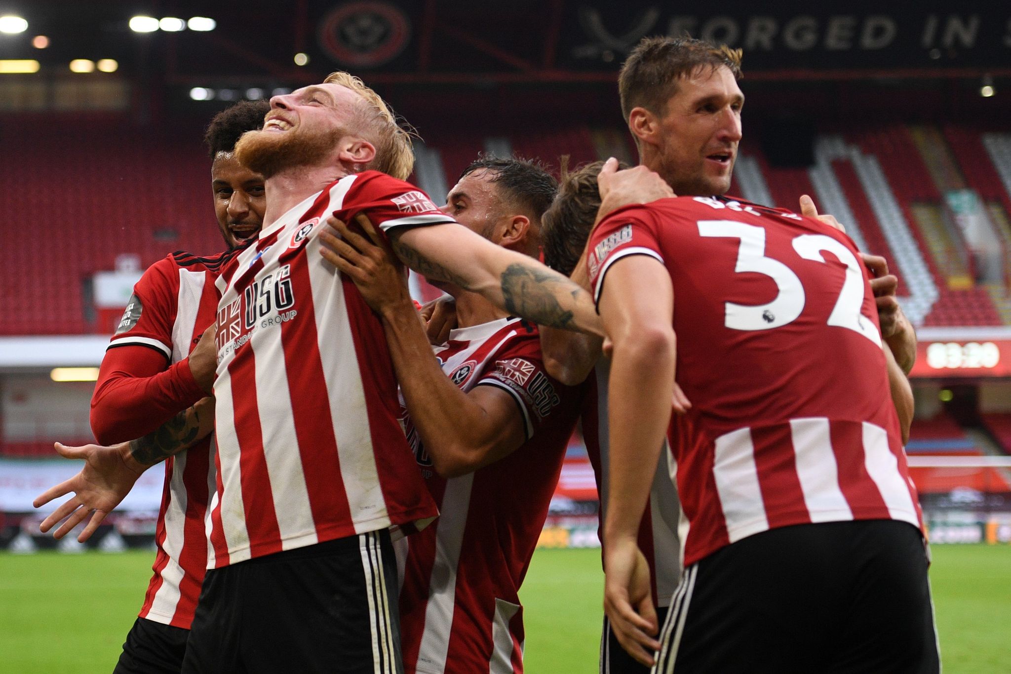  lt;HIT gt;Sheffield lt;/HIT gt; Uniteds English-born Scottish striker Oliver McBurnie (2nd L) celebrates with teammates after scoring their third goal during the English Premier League football match between lt;HIT gt;Sheffield lt;/HIT gt; United and Tottenham Hotspur at Bramall Lane in lt;HIT gt;Sheffield lt;/HIT gt;, northern England on July 2, 2020. (Photo by Oli SCARFF / POOL / AFP) / RESTRICTED TO EDITORIAL USE. No use with unauthorized audio, video, data, fixture lists, club/league logos or live services. Online in-match use limited to 120 images. An additional 40 images may be used in extra time. No video emulation. Social media in-match use limited to 120 images. An additional 40 images may be used in extra time. No use in betting publications, games or single club/league/player publications. /