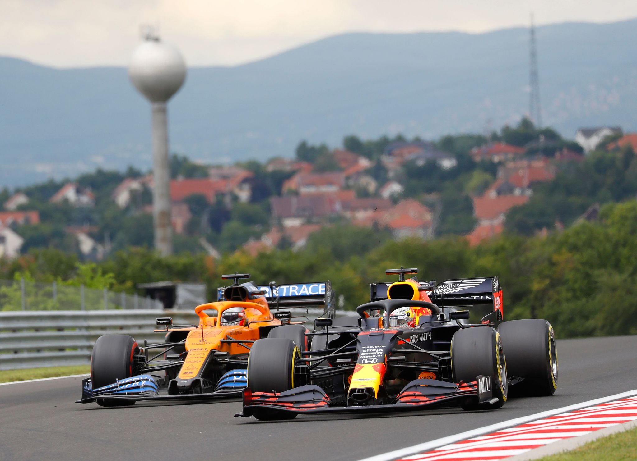 McLarens Spanish driver lt;HIT gt;Carlos lt;/HIT gt; lt;HIT gt;Sainz lt;/HIT gt; Jr (L) and Red Bulls Dutch driver Max Verstappen steer their cars during the third practice session for the Formula One Hungarian Grand Prix at the Hungaroring circuit in Mogyorod near Budapest, Hungary, on July 18, 2020. (Photo by Leonhard Foeger / POOL / AFP)