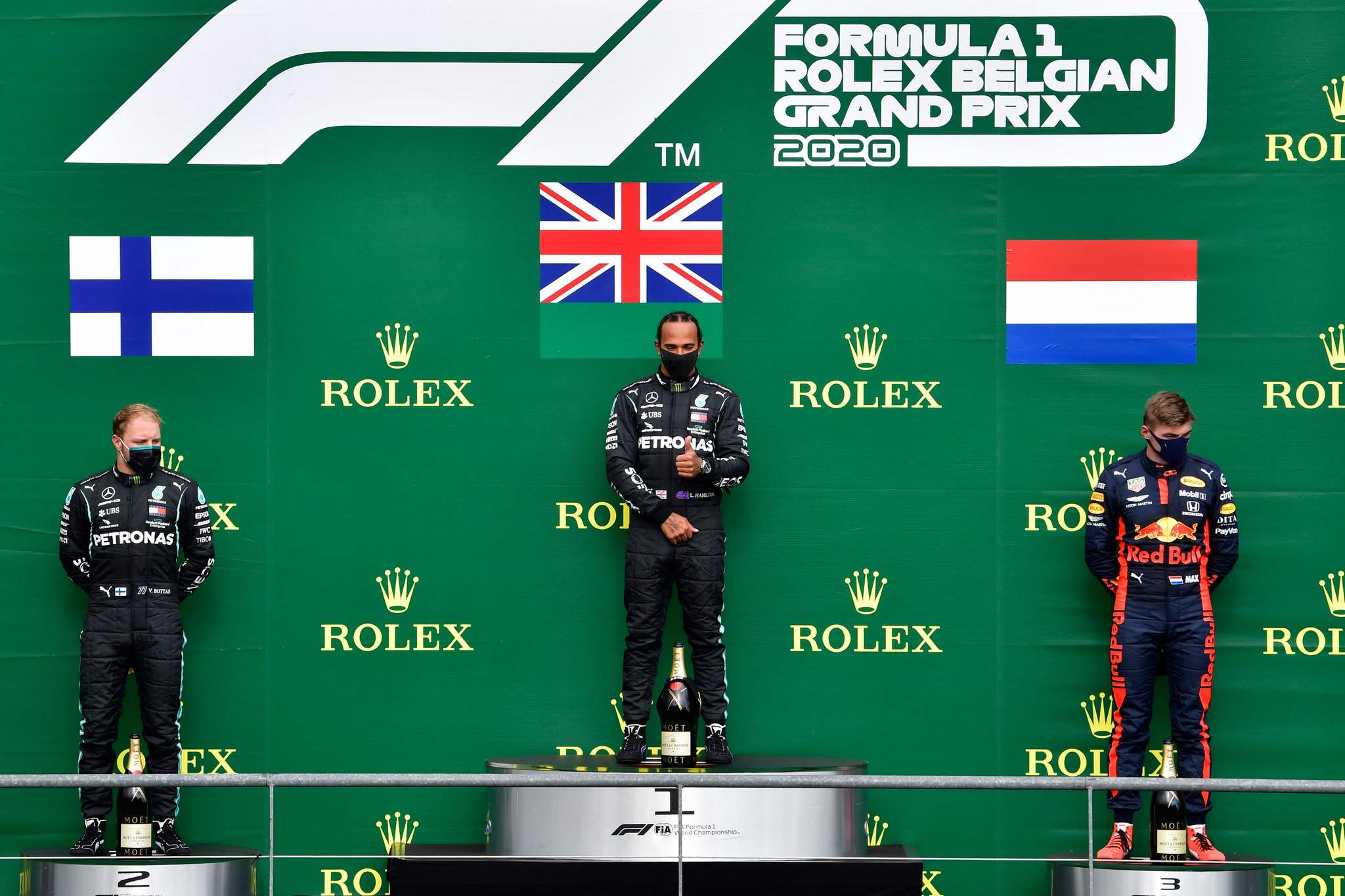 Winner Mercedes British driver Lewis Hamilton (C) celebrates on the podium next to second placed Mercedes Finnish driver Valtteri Bottas (L) and third placed Red Bulls Dutch driver Max lt;HIT gt;Verstappen lt;/HIT gt; after the Belgian Formula One Grand Prix at the Spa-Francorchamps circuit in Spa on August 30, 2020. (Photo by JOHN THYS / POOL / AFP)