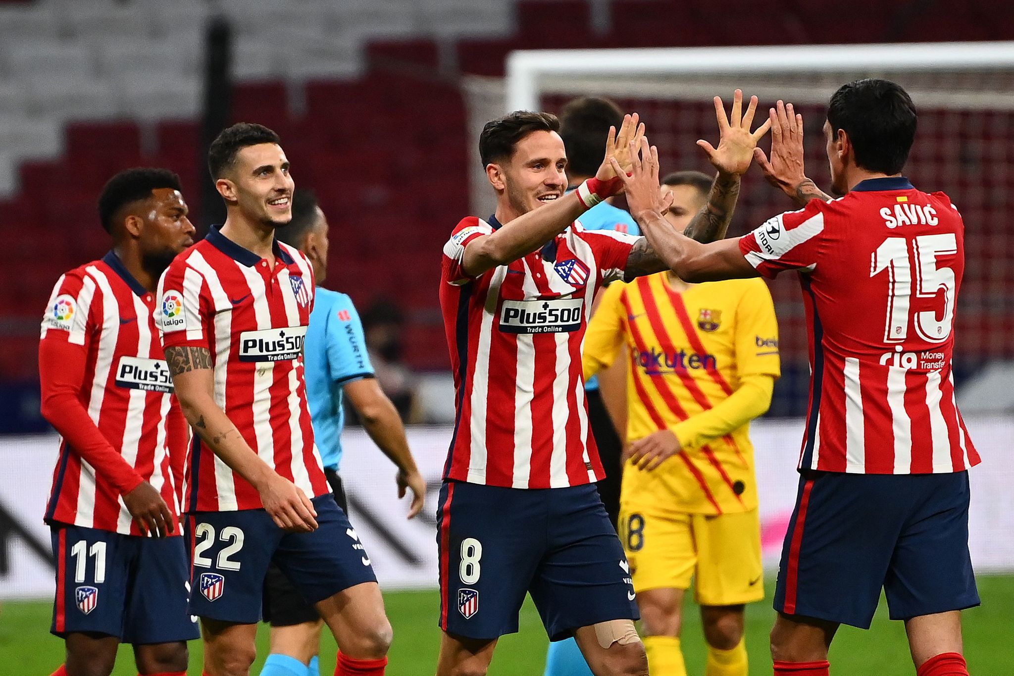 lt;HIT gt;Atletico lt;/HIT gt; lt;HIT gt;Madrid lt;/HIT gt;'s players celebrate at the end of the Spanish League football match between Club lt;HIT gt;Atletico lt;/HIT gt; de lt;HIT gt;Madrid lt;/HIT gt; and FC Barcelona at the Wanda Metropolitano stadium in lt;HIT gt;Madrid lt;/HIT gt; on November 21, 2020. (Photo by GABRIEL BOUYS / AFP)