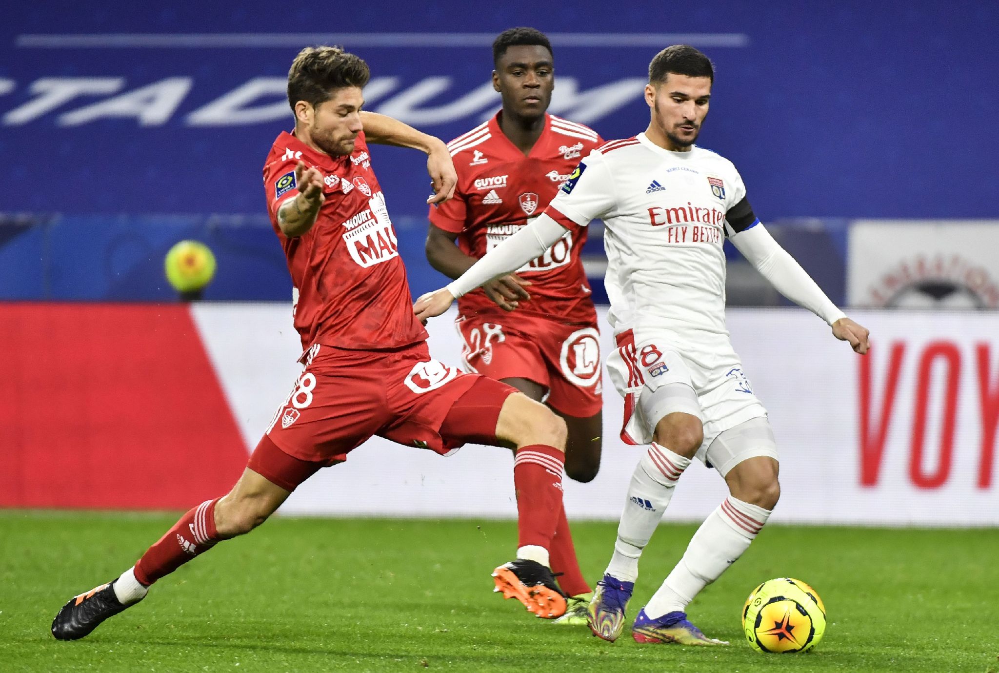 lt;HIT gt;Lyon lt;/HIT gt;'s French midfielder Houssem lt;HIT gt;Aouar lt;/HIT gt; (R) fights for the ball with Brest's French midfielder Paul Lasne (L) during the French L1 football match between Olympique Lyonnais and Le Stade Brestois 29 at the Groupama stadium in Decines-Charpieu, near lt;HIT gt;Lyon lt;/HIT gt;, south-eastern France, on December 16, 2020. (Photo by PHILIPPE DESMAZES / AFP)