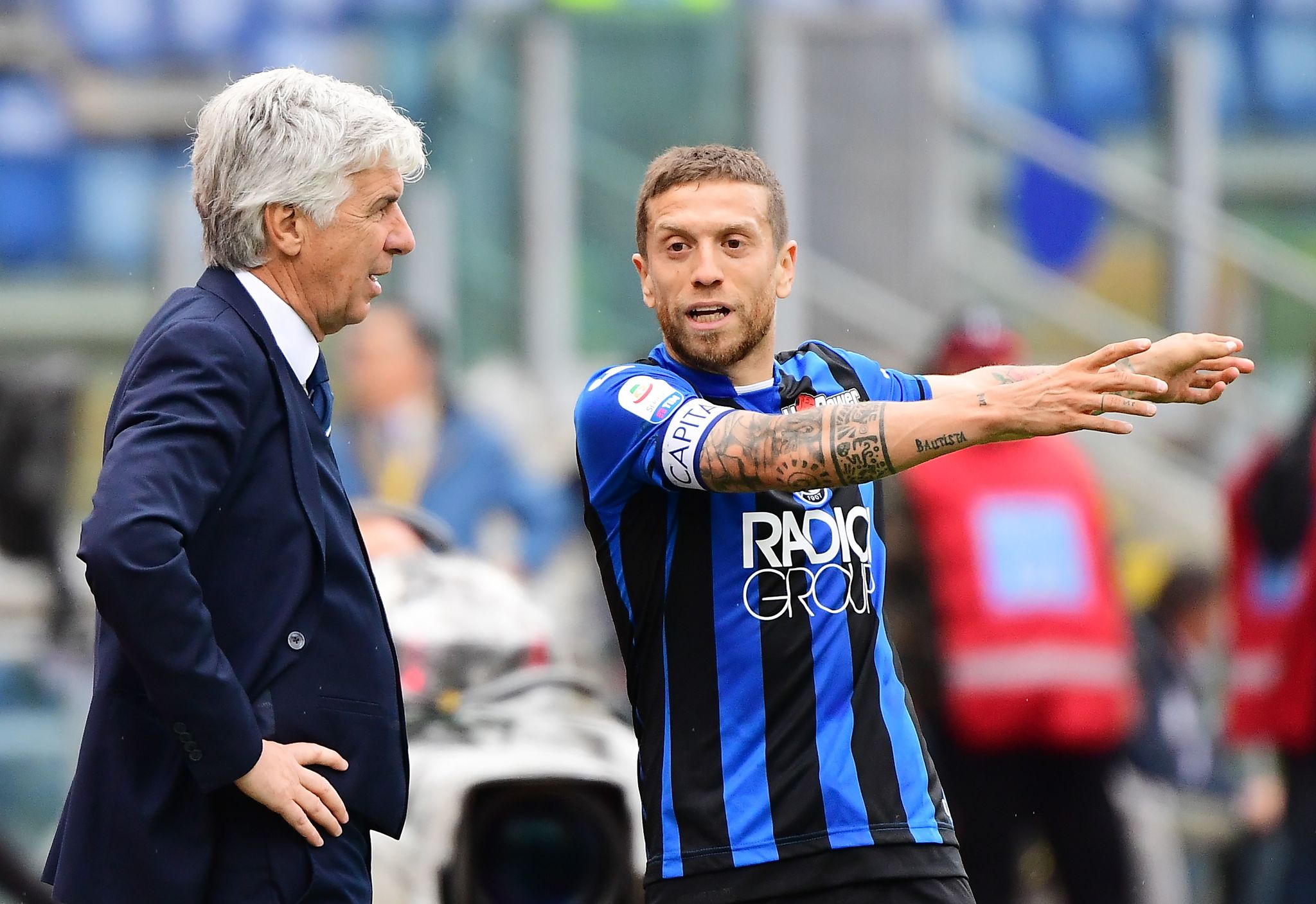 (FILES) In this file photo taken on May 05, 2019 lt;HIT gt;Atalanta lt;/HIT gt;'s coach from Italy Gian Piero Gasperini (L) talks with lt;HIT gt;Atalanta lt;/HIT gt;'s forward from Argentina Alejandro lt;HIT gt;Gomez lt;/HIT gt; during the Italian Serie A football match Lazio vs lt;HIT gt;Atalanta lt;/HIT gt; on May 5, 2019 at the Olympic stadium in Rome. - According to press reports, lt;HIT gt;Atalanta lt;/HIT gt;'s President Antonio Percassi has accepted the idea of lt;HIT gt;Gomez lt;/HIT gt; leaving in January 2021. Several Italian clubs are said to be on the lookout, including AC Milan, but the Paris SG of lt;HIT gt;Gomez lt;/HIT gt;' fellow countryman Angel Di Maria has also been cited as a possible destination. (Photo by Vincenzo PINTO / AFP)
