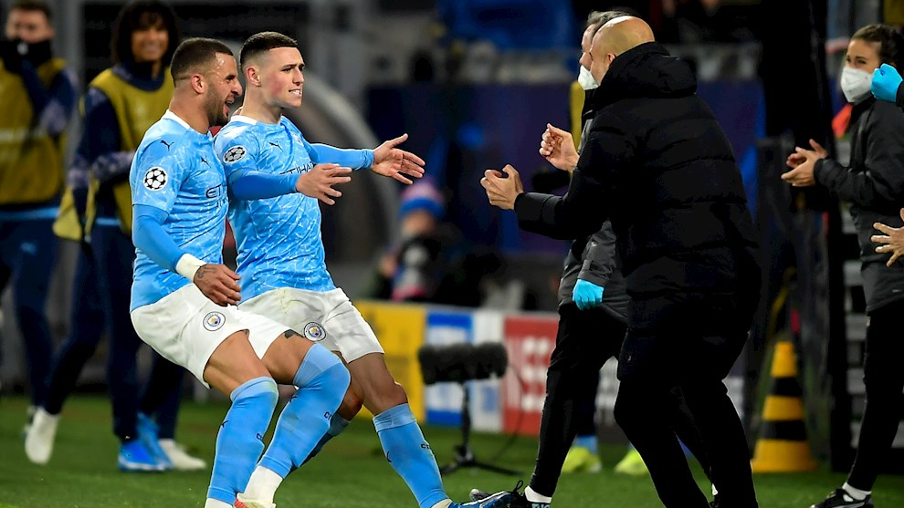Manchester City midfielder Phil Foden celebrating his goal against Borussia Dortmund with Pep Guardiola.