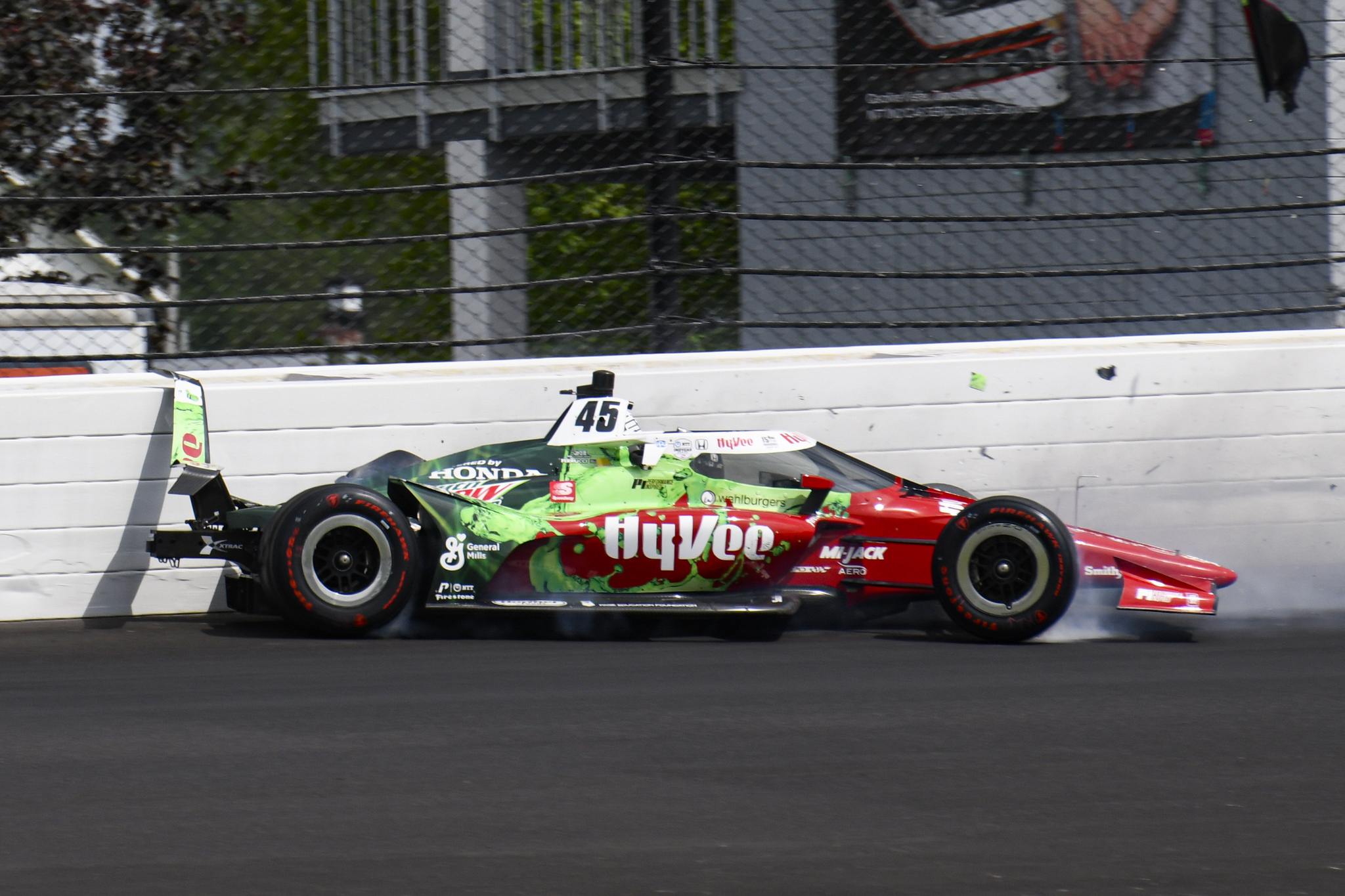 Santino Ferrucci hits the wall in the second turn during practice for the Indianapolis 500 auto race at Indianapolis Motor Speedway in Indianapolis, Thursday, May 20, 2021. (AP Photo/Jamie Gallagher)