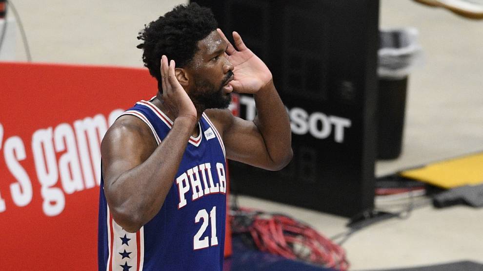 Joel Embiid listens to the fans