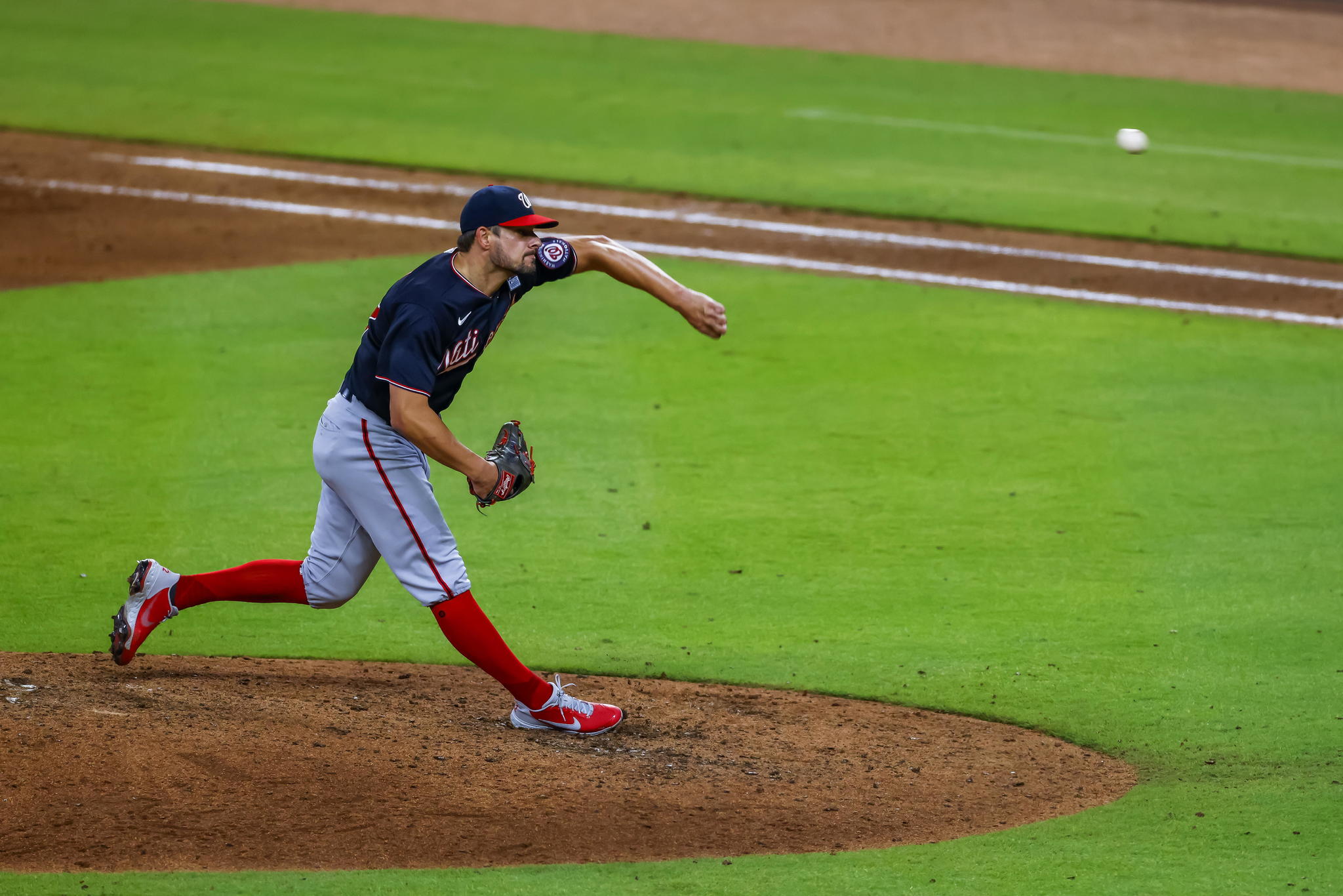 Washington Nationals relief pitcher Brad Hand delivers to an Atlanta Braves batter.