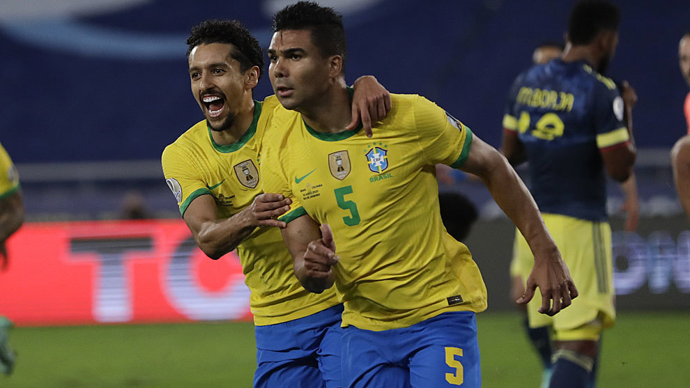 Brazil's Casemiro, right, celebrates with teammate Marquinhos after scoring his side's 2nd goal against Colombia