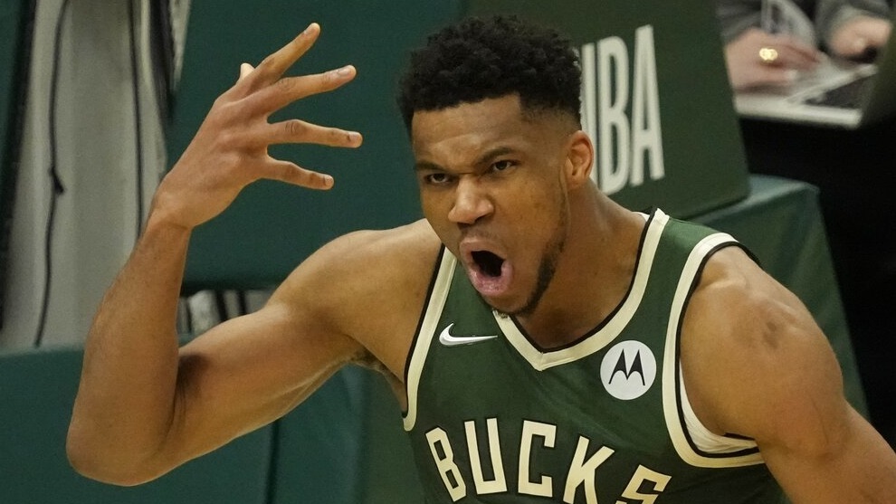 Milwaukee Bucks' Giannis Antetokounmpo reacts after making a shot and being fouled during the second half.