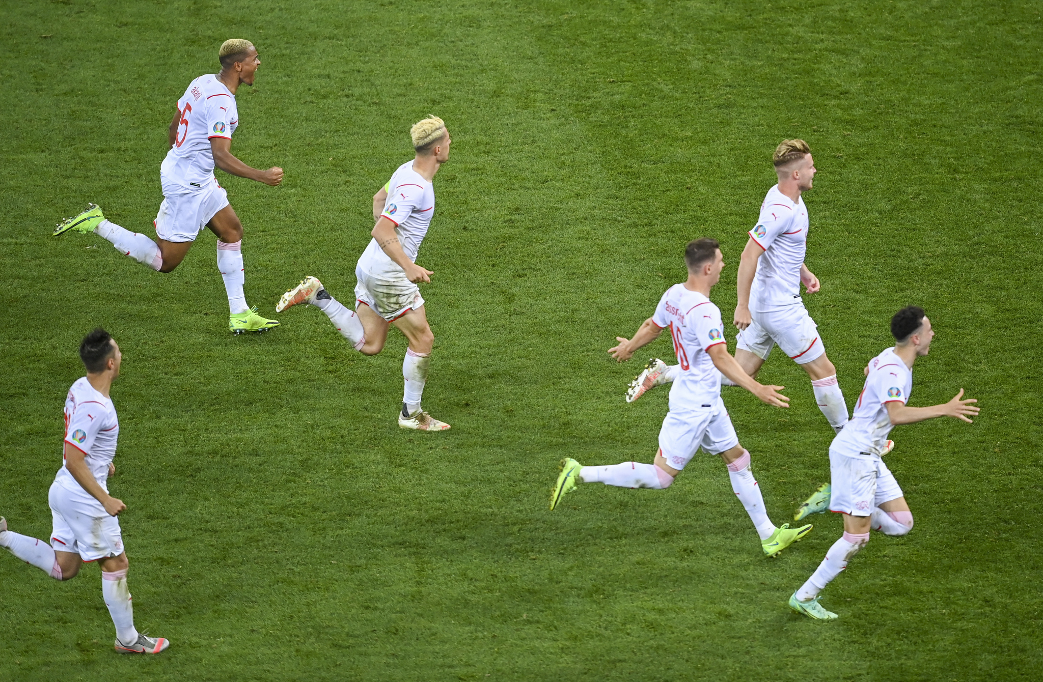 The Switzerland players celebrate beating France on penalties.
