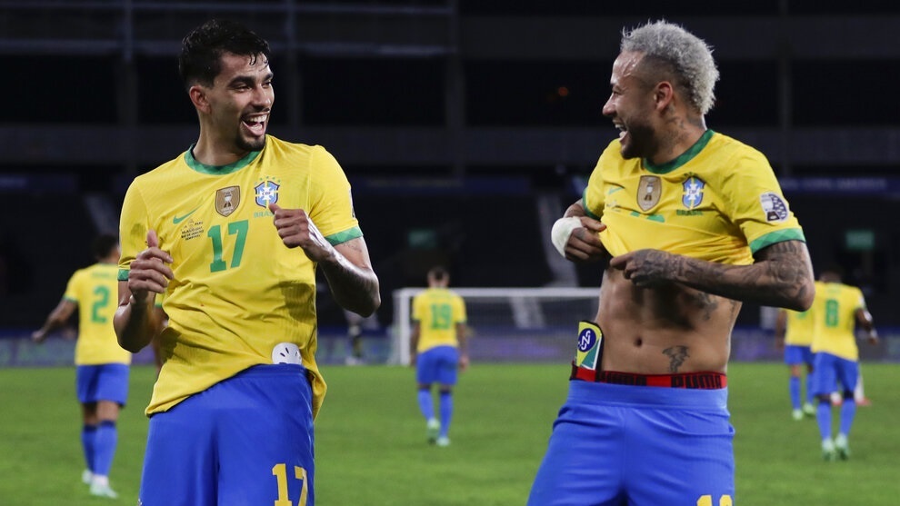 Lucas Paqueta celebrates with teammate Neymar after scoring his side's opening goal against Peru.