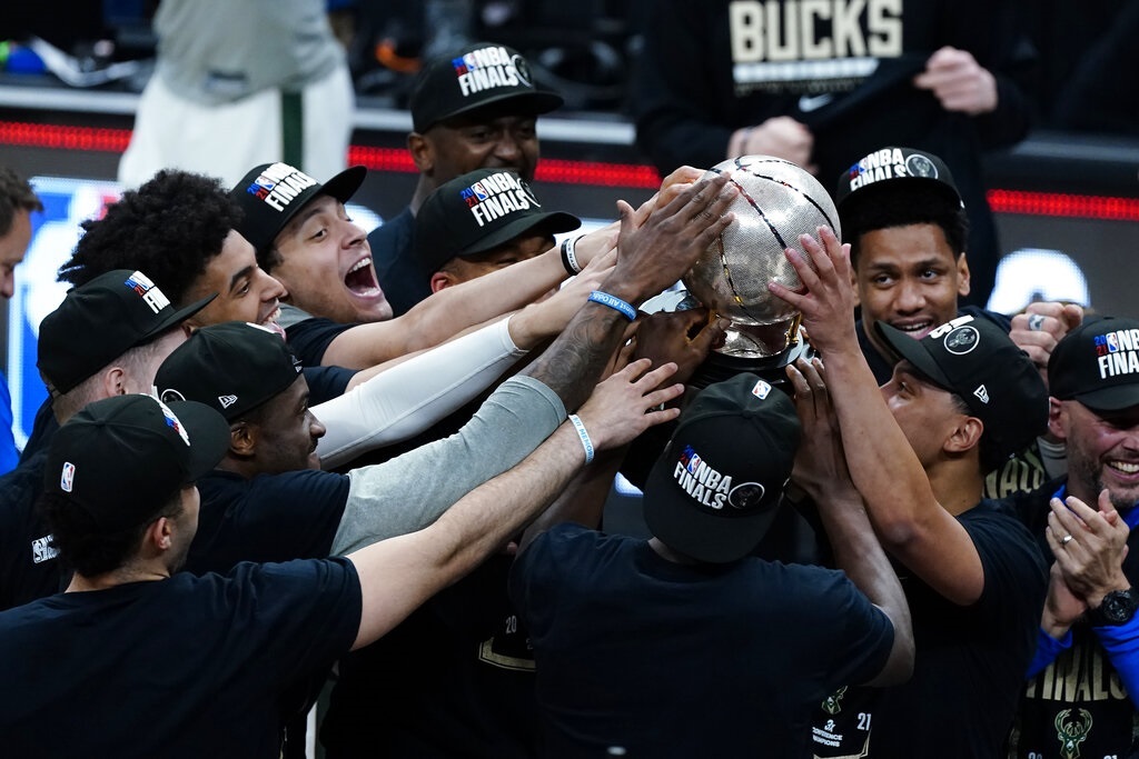 The Milwaukee Bucks hoist the trophy after defeating the Atlanta Hawks in Game 6 of the Eastern Conference finals.