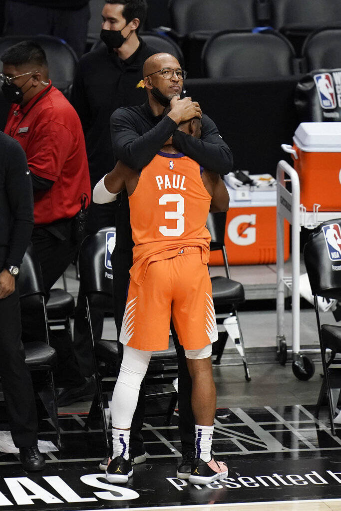 Phoenix Suns head coach Monty Williams hugs Chris Paul.