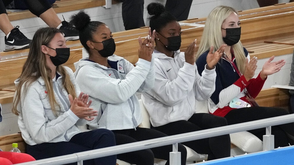 Grace McCallum, Jordan Chiles, Simone Biles and MyKayla Skinner celebrate after teammate Sunisa Lee won the gold medal.