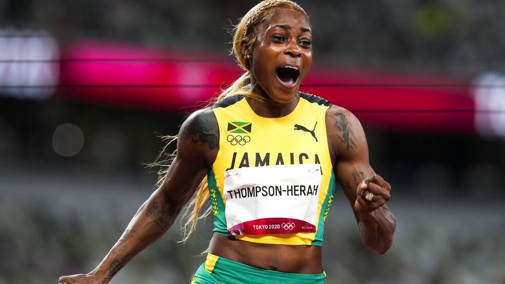 Elaine Thompson-Herah, of Jamaica, wins the women's 100-meter final.