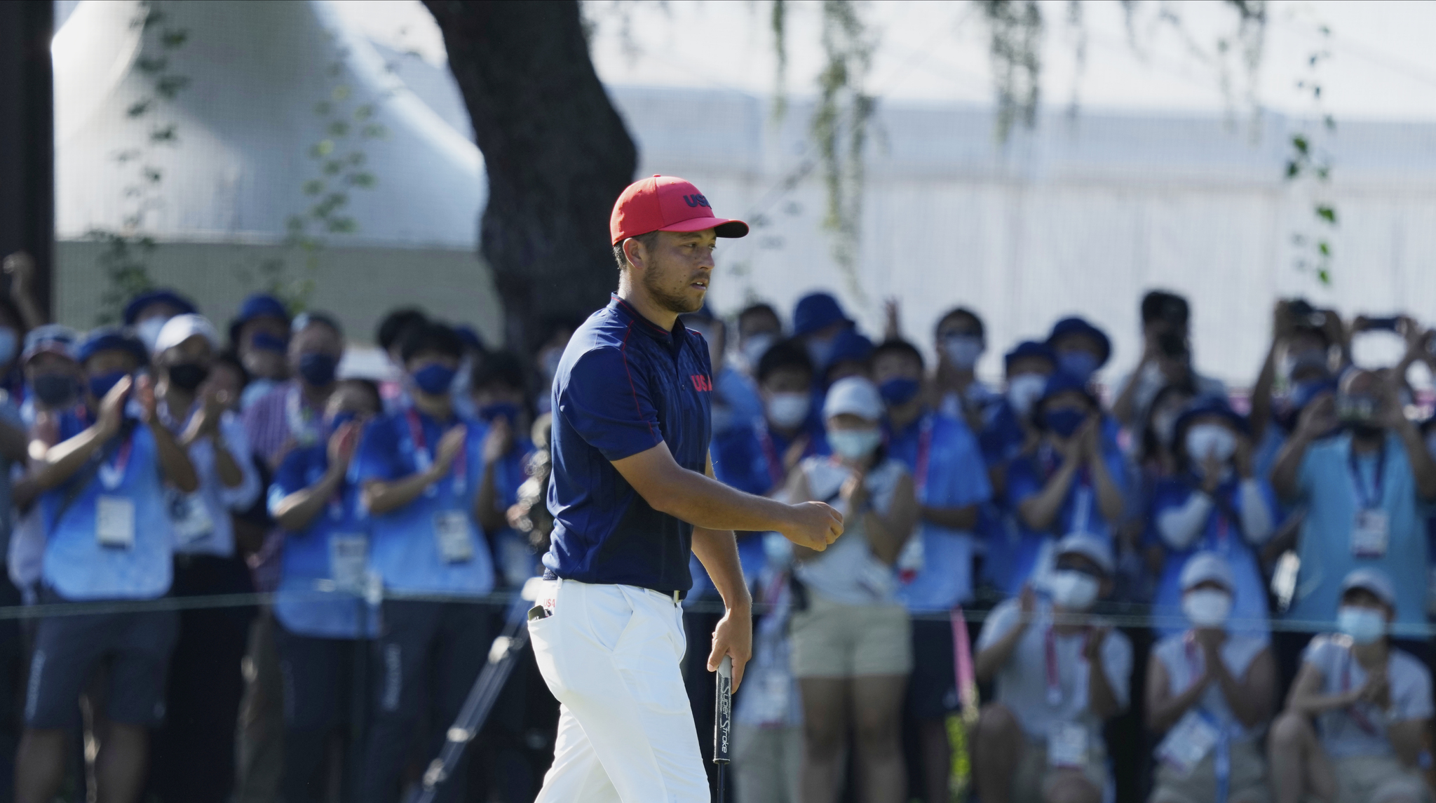 USA's Xander Schauffele reacts after winning the gold medal in the men's golf event.