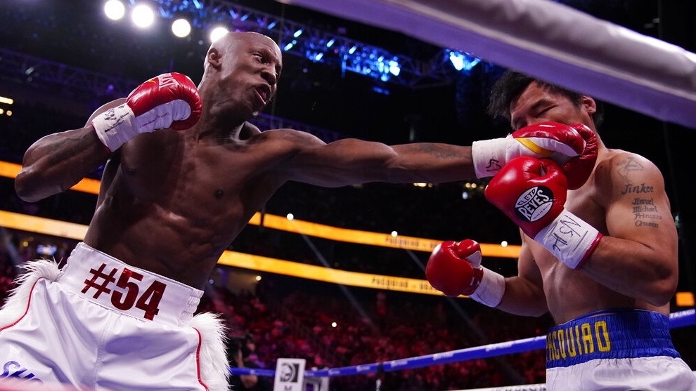 Manny Pacquiao is hit by Yordenis Ugas.