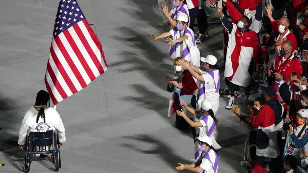 The flag of the United States enters the stadium during the closing ceremony.