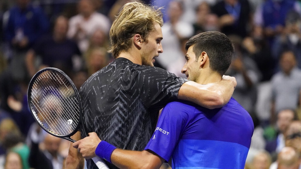 Novak Djokovic and Alexander Zverev embrace after Djokovic won their semifinal match of the US Open.