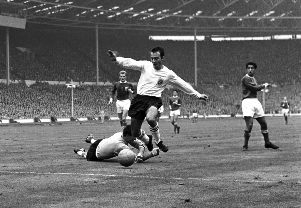 In this Oct. 23, 1965 file photo, Greaves vies for the ball against Yugoslav goalkeeper Milutin Soskic.