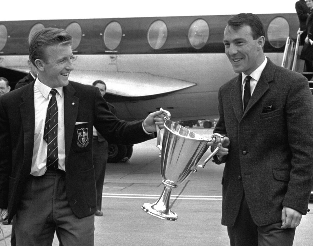 In this May 16, 1963 file photo, Jimmy Greaves and Terry Dyson carry the European Cup Winners Cup.