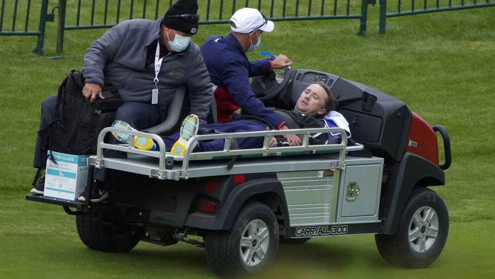 Actor Tom Felton is helped after collapsing on the 18th hole during a practice day at the Ryder Cup.