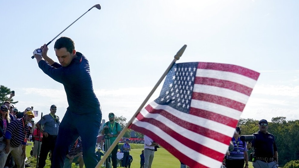 Team USA's Patrick Cantlay hits on the 10th hole during a four-ball match.