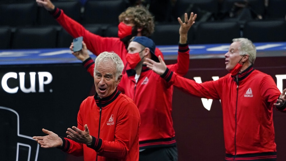 Team World's captain John McEnroe, bottom left, vice captain Patrick McEnroe, far right, and teammates applaud a point.