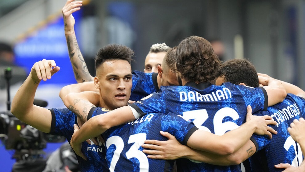 Inter Milan's Lautaro Martinez, left, celebrates with teammates after scoring his side's first goal.