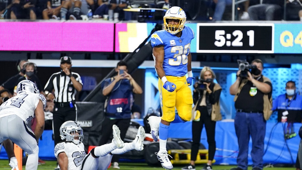 Los Angeles Chargers running back Austin Ekeler, right, reacts after scoring a touchdown.