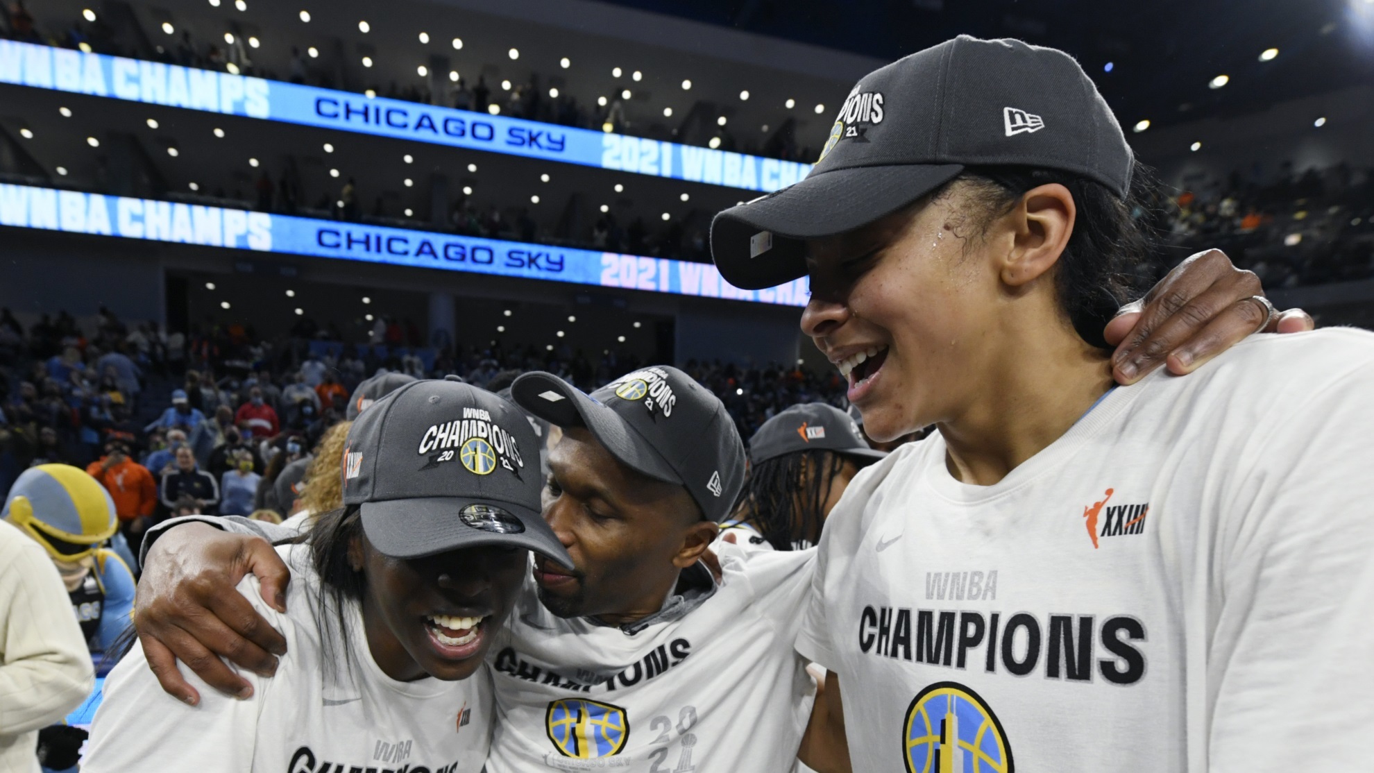 Chicago Sky head coach James Wade celebrates with Candice Parker and Kahleah Copper.