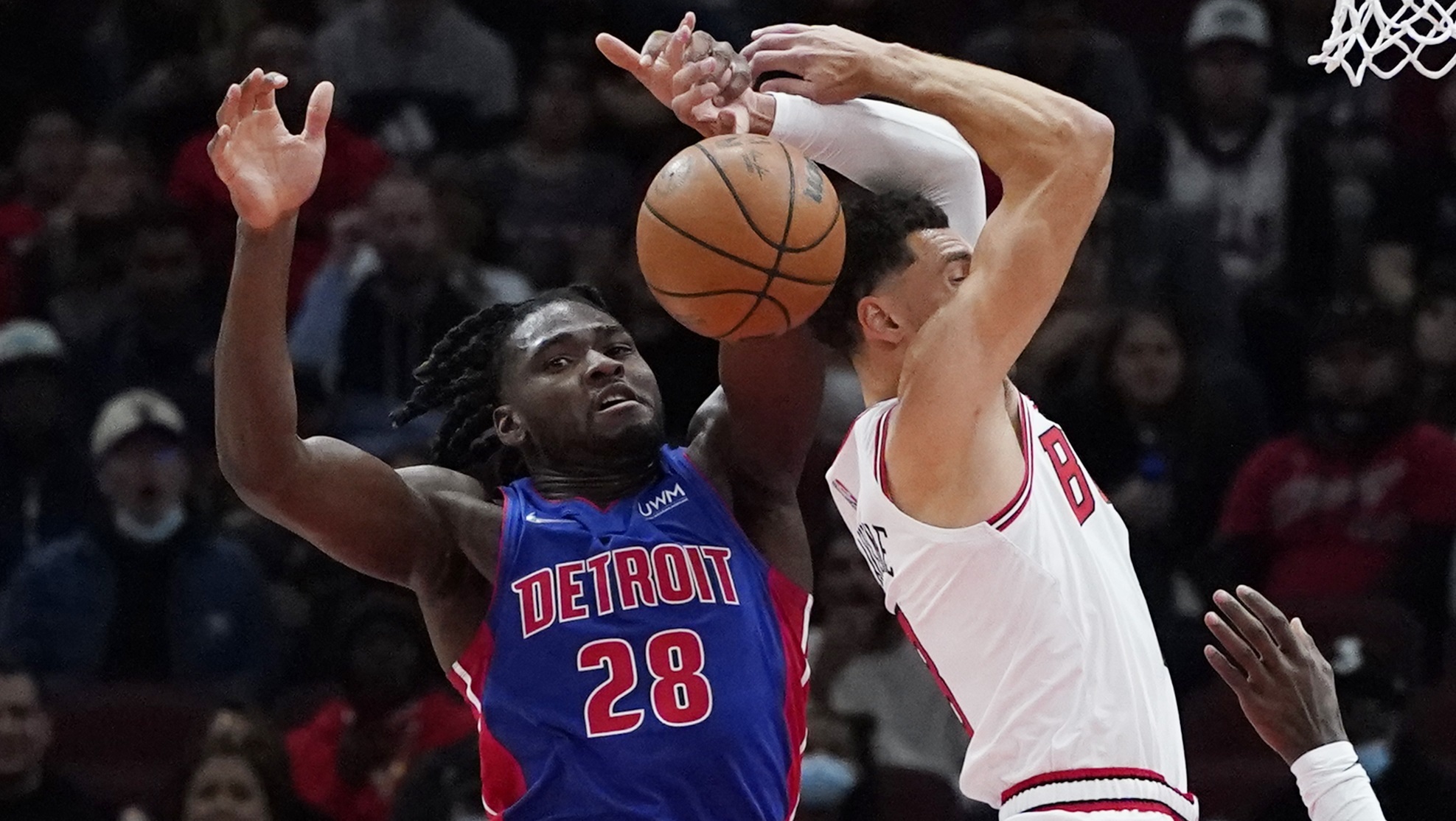 Detroit Pistons center Isaiah Stewart, left, blocks a shot by Chicago Bulls guard Zach LaVine.