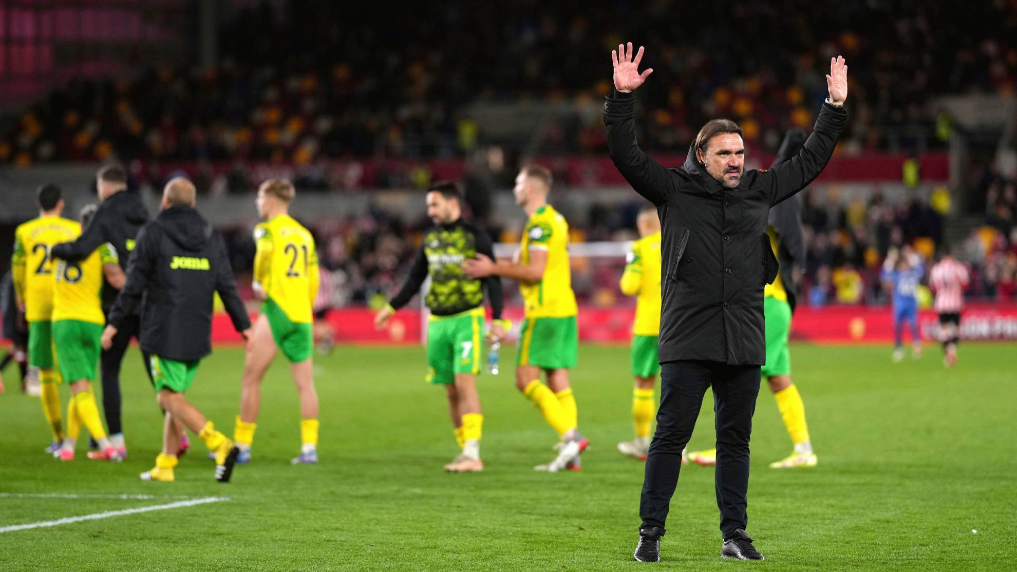 Norwich City manager Daniel Farke salutes the fans after the final whistle of the English Premier League soccer match between Brentford and Norwich City.