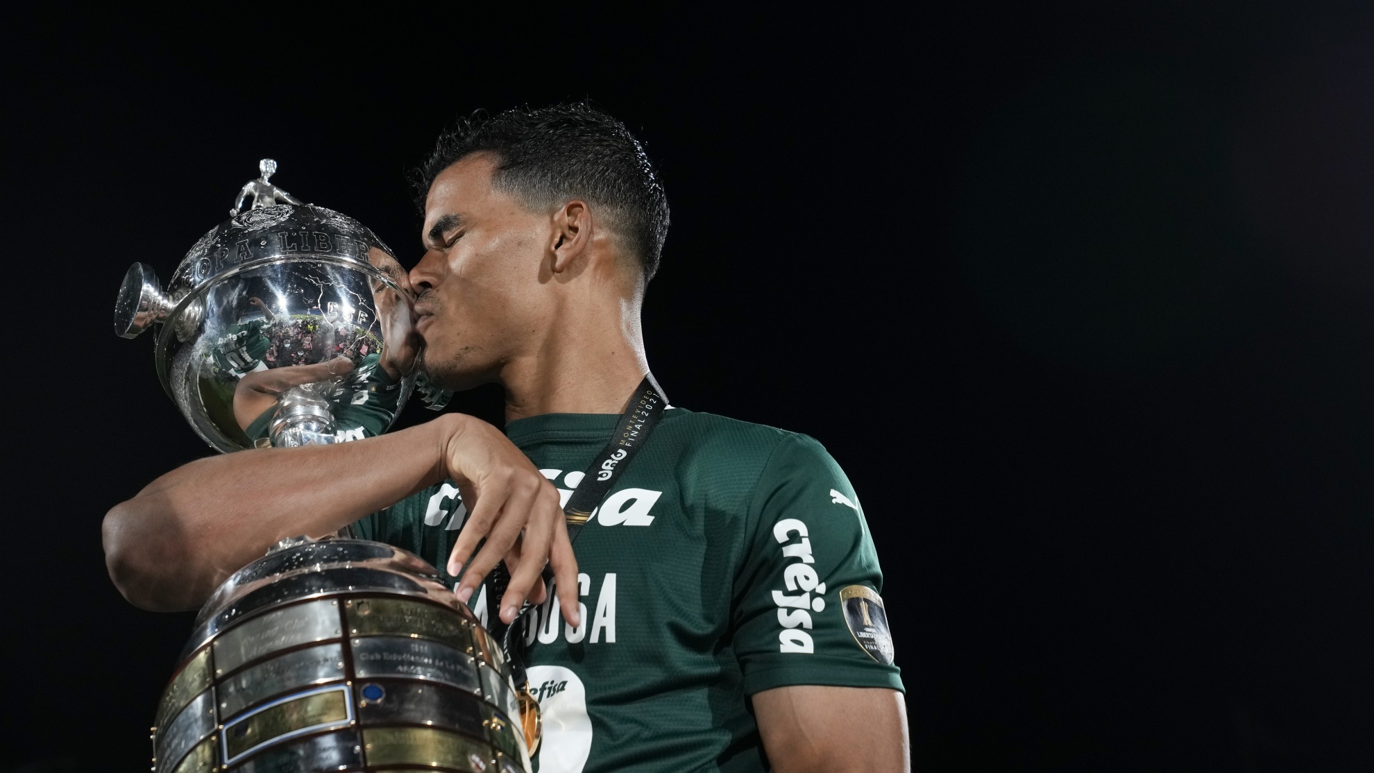 Danilo of Brazil's Palmeiras kisses the trophy.