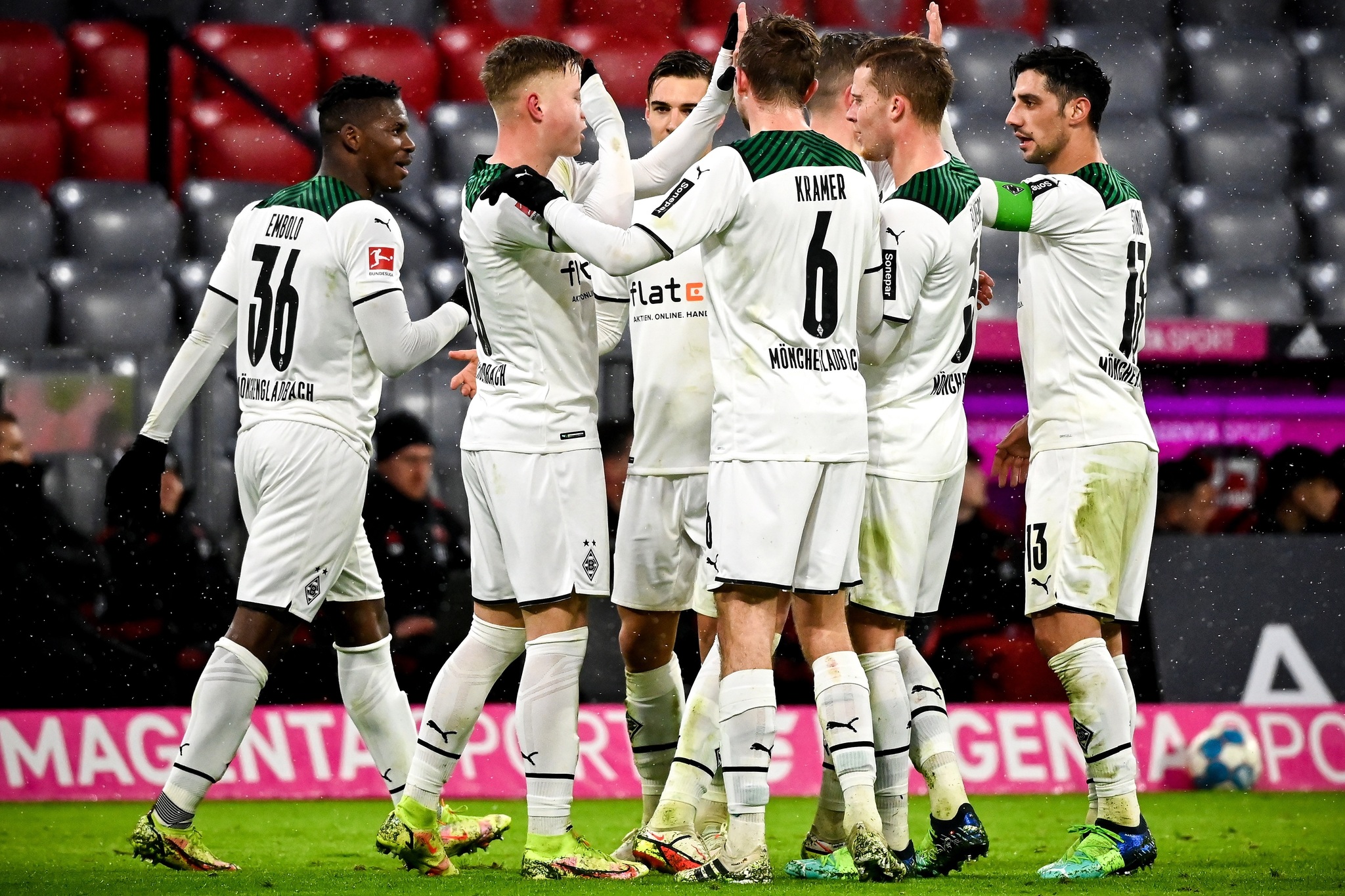 Moenchengladbach players celebrate taking a 2-1 lead