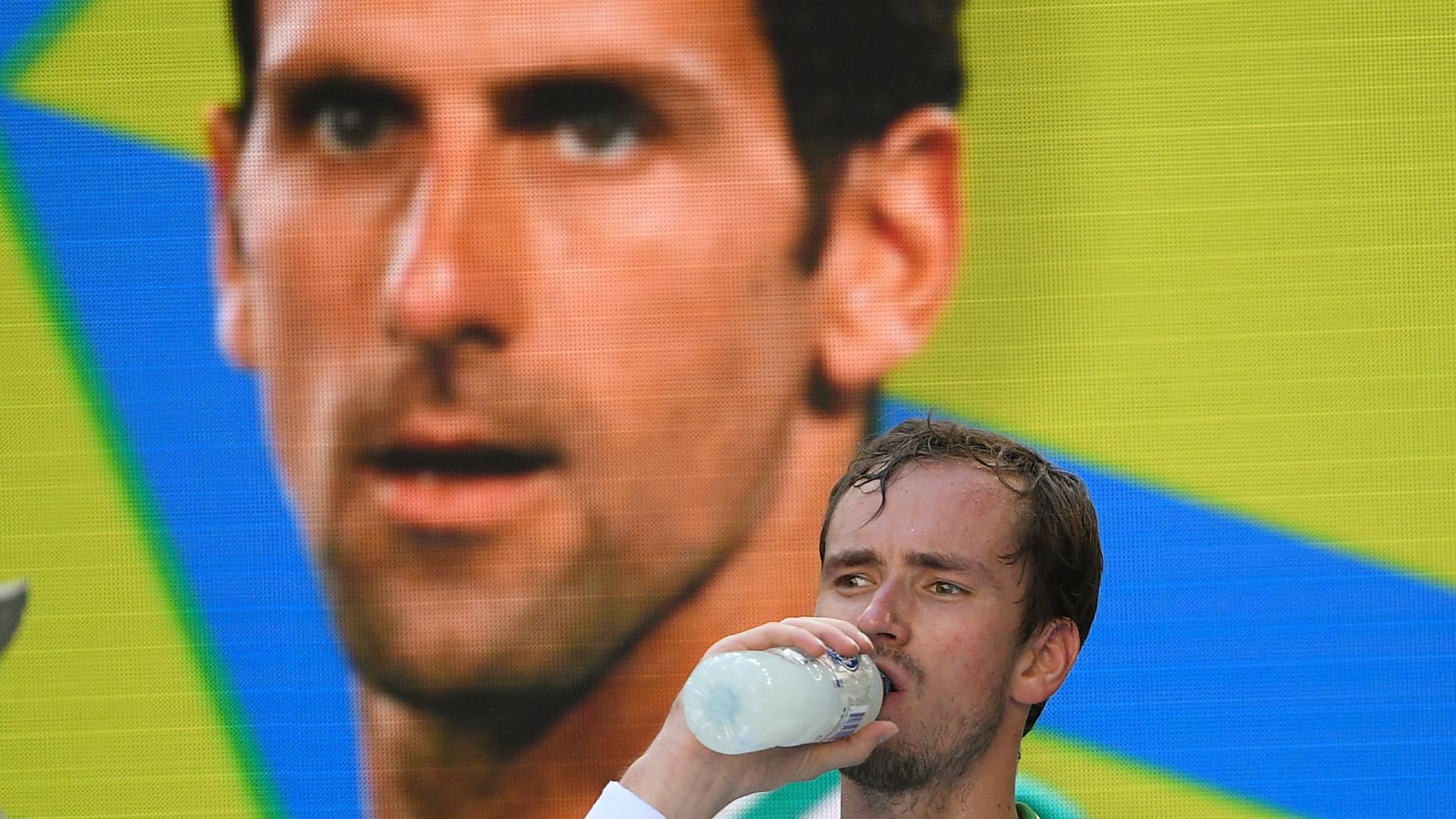 Daniil Medvedev of Russia takes a drink during a break in his third round match against Botic van de Zandschulp.