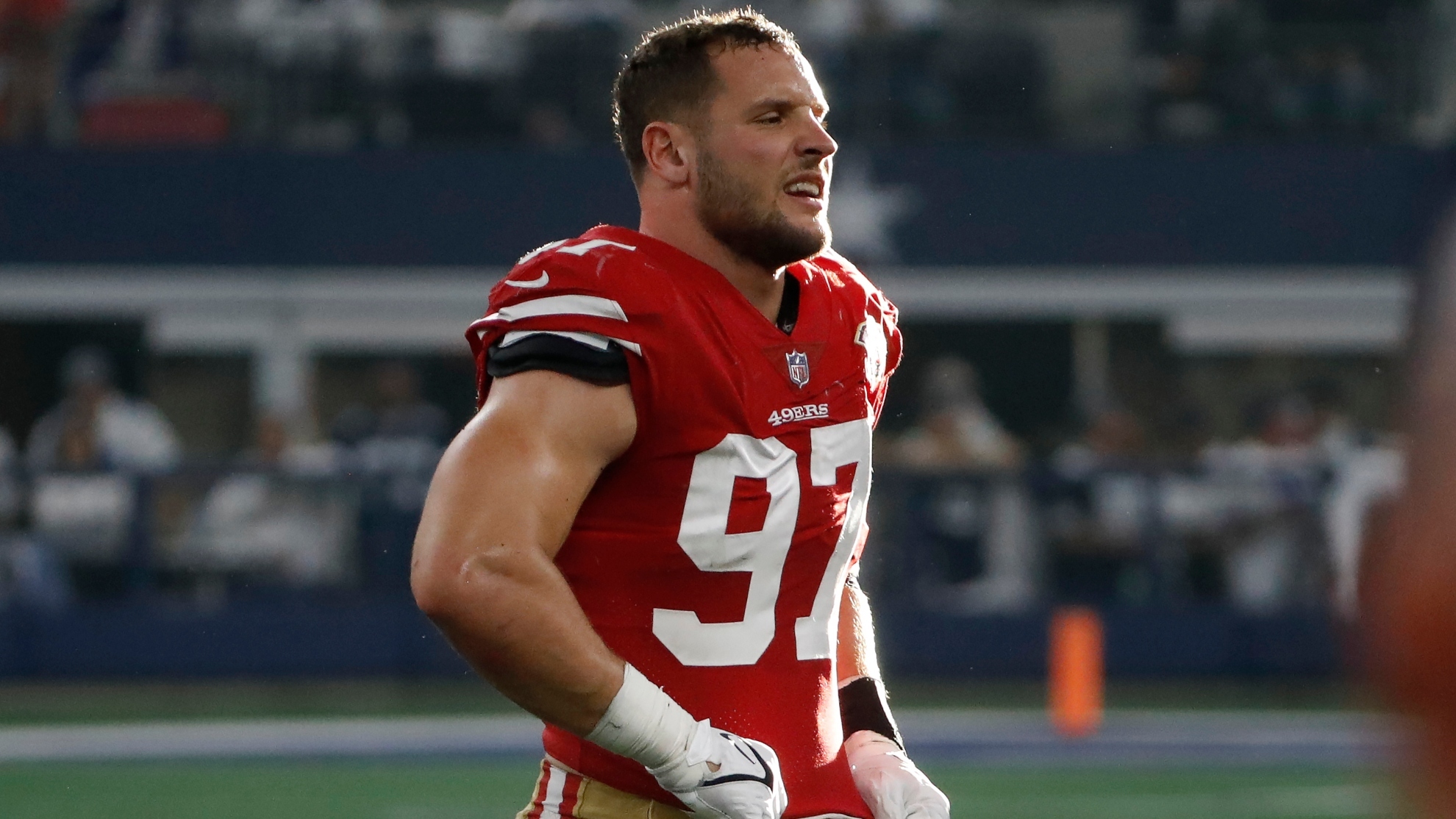 San Francisco 49ers defensive end Nick Bosa walks off the field during the first half of an NFL wild-card playoff football game against the Dallas Cowboys in Arlington, Texas, Sunday, Jan. 16, 2022.