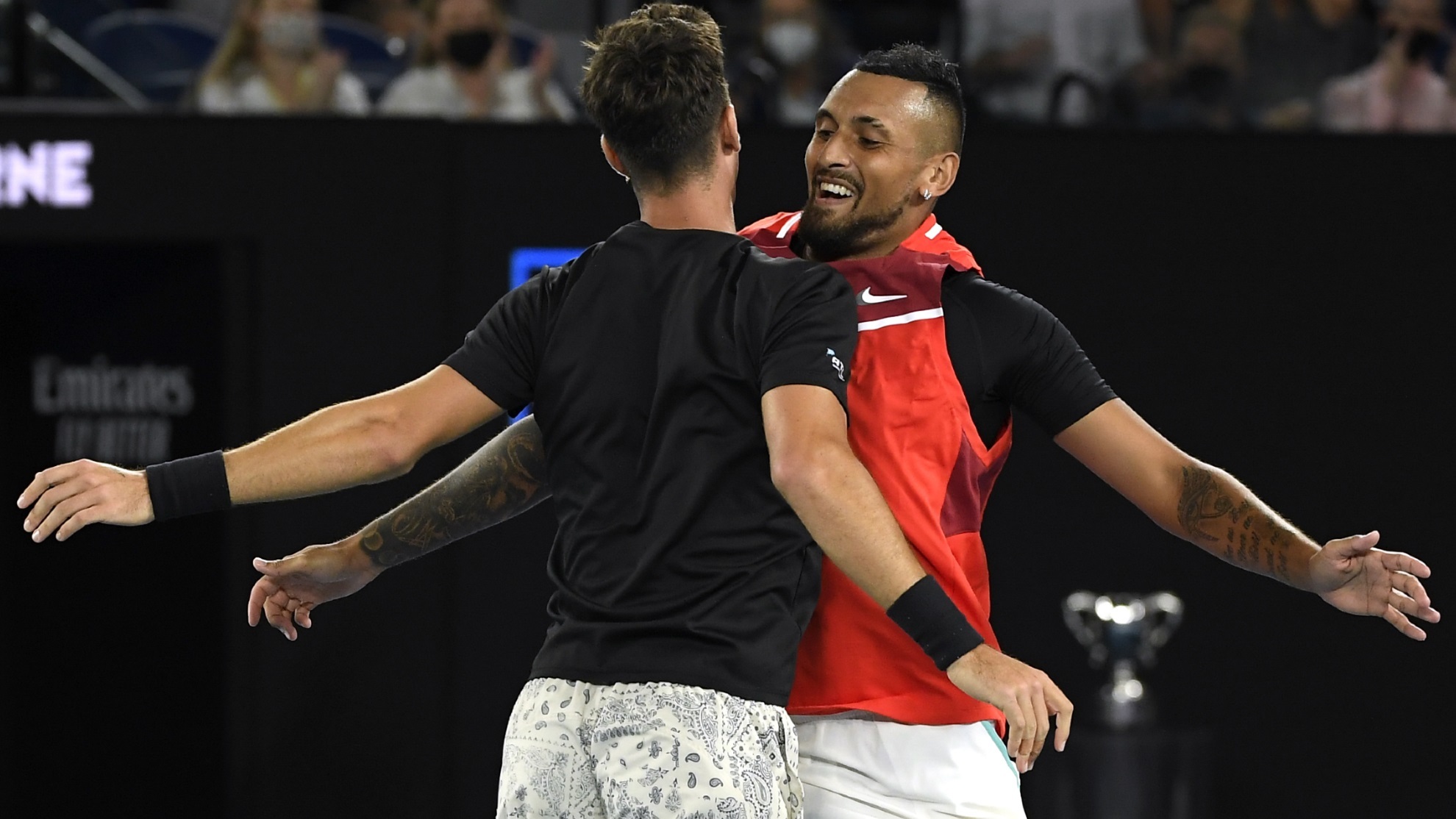 Nick Kyrgios, right, and Thanasi Kokkinakis of Australia celebrate after defeating compatriots Matthew Ebden and Max Purcell.
