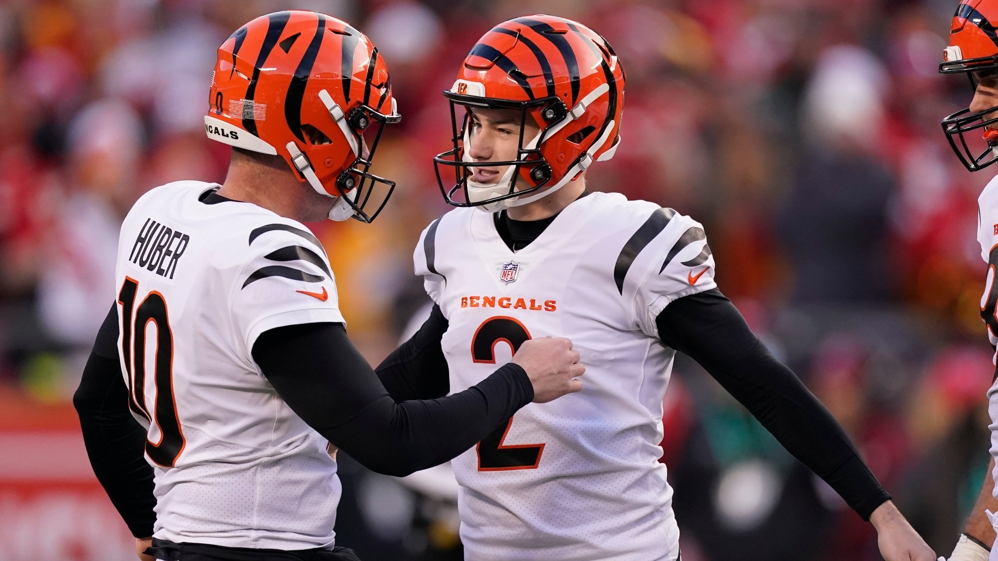 Cincinnati Bengals kicker Evan McPherson (2) celebrates with teammate Kevin Huber (10) after kicking a 52-yard field goal during the second half of the AFC championship NFL football game against the Kansas City Chiefs