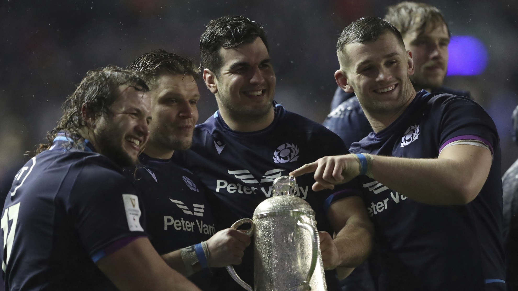 Members of the Scottish team pose with the Calcutta Cup after defeating England.