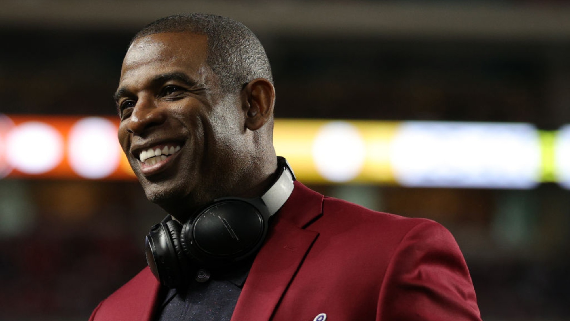 Deion Sanders of the NLF 100 All-Time Team is honored on the field prior to Super Bowl LIV in Miami.