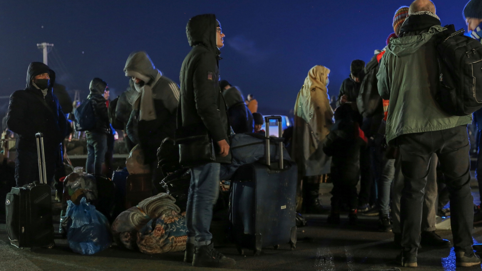 Refugees arrive at the Medyka border crossing after fleeing from the Ukraine, in Poland, Monday, Feb. 28, 2022.