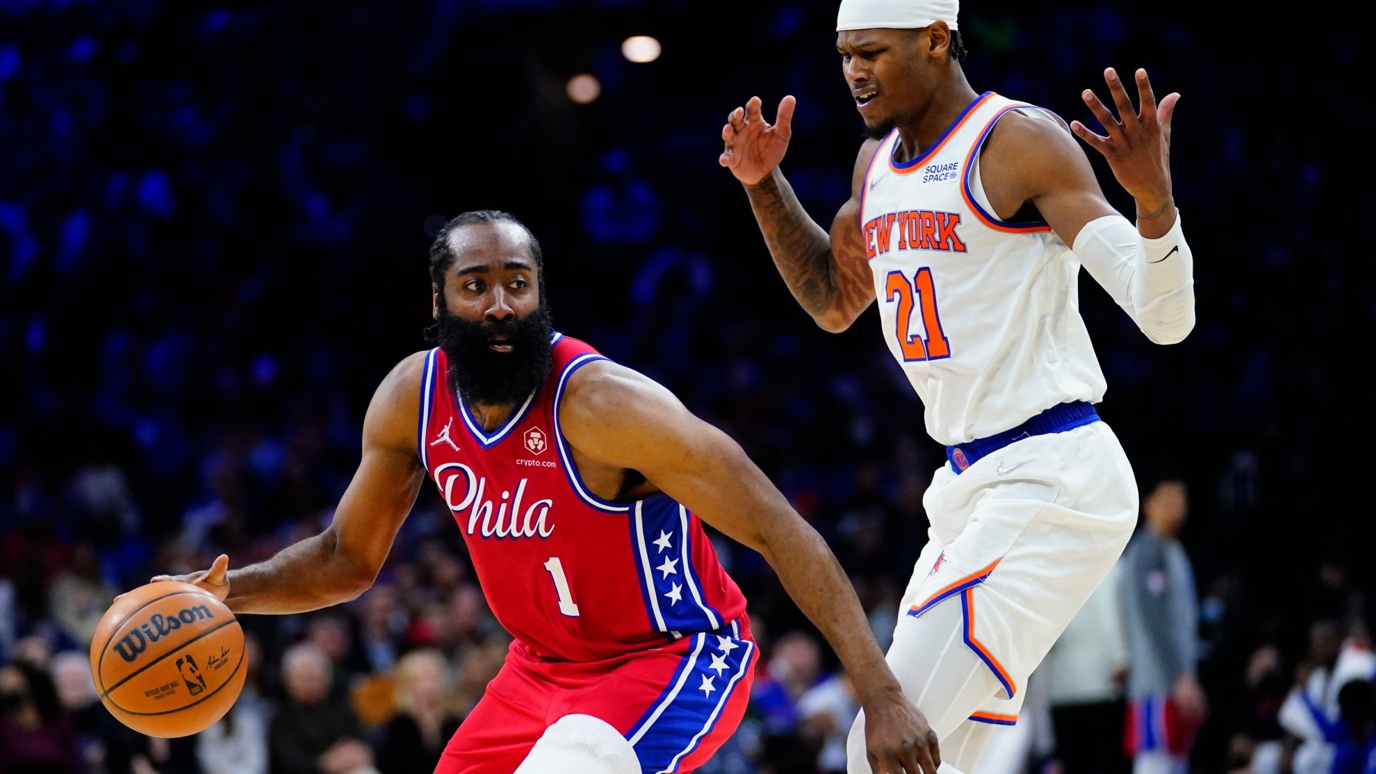 Philadelphia 76ers' James Harden, left, dribbles past New York Knicks' Cam Reddish